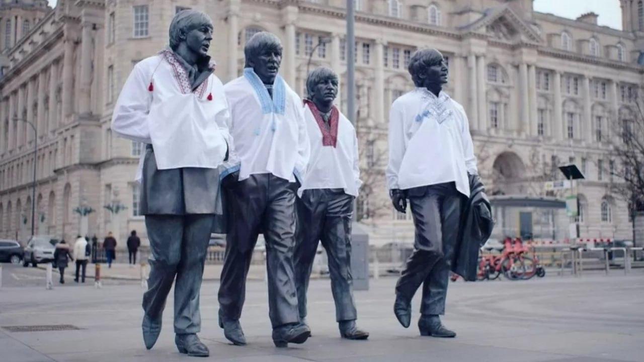 Monument to the Beatles in the UK dressed up in Ukrainian vyshyvanka